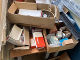 a pile of boxes that are sitting on the floor