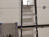 a ladder that is leaning against a wall in a room