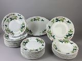 a group of plates with flowers and leaves on them