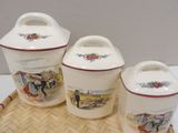 three ceramic containers sitting on top of a bamboo tray