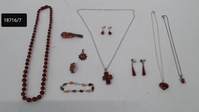 a lot of necklaces and bracelets that are on a table
