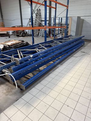 an image of a large warehouse with a lot of shelves