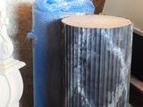 two vases sitting next to each other on the floor