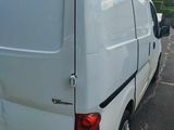 a white van that is parked in a parking lot