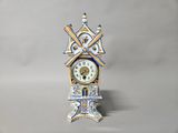 a blue and white clock sitting on a table