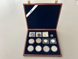 a wooden case with a lot of coins inside of it