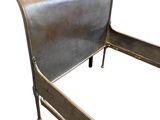 a metal bed frame with a sleigh on top of it