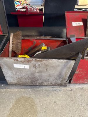 a tool box with tools in it sitting on the floor