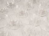 a lot of empty wine glasses sitting on a table