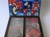 a box of lego technics on a white surface