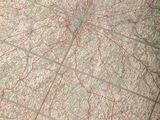 a cat that is sitting on a map of the world