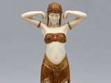 a figurine of a woman in a bikini and headdress