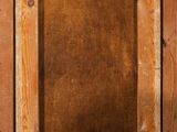 an old wooden picture frame with a picture hanging on it