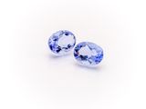a pair of tanzane blue sapphires on a white background