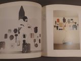 an open book with a picture of a woman in a hat