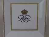 a close up of a plate with a crown on it