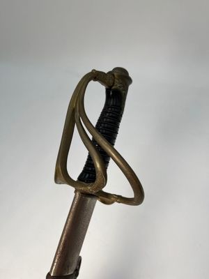 a close up of a sword on a white background