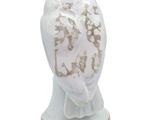an image of a white owl figurine on a gold base