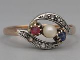 an image of a ring with a pearl and sapphires