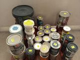 many cans of paint and cans of paint on a pallet