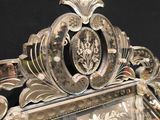 a mirror that has a decorative design on it