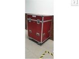 an image of a red case sitting on top of a hard wood floor