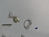 many different types of jewelry that are on the table