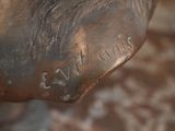 a bronze statue of an elephant with writing on it ' s back