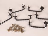 four pairs of metal hooks and screws on a white surface