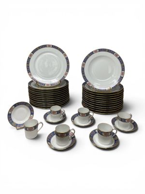 a lot of plates and cups that are stacked together