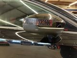 an image of a car with a clock on the side of it
