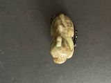 a small figurine of a person on a table