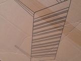 a cardboard box with a drawing of a tall building on it