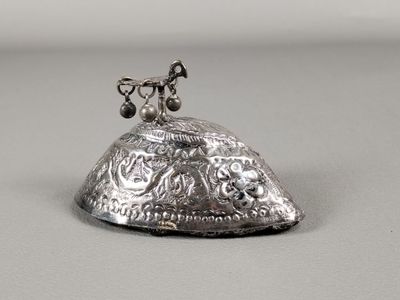 an image of a silver bell with a chain on it