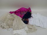 a pile of clothing that is on a table