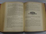 an open book with a picture of a boat on it
