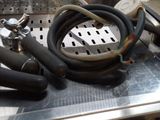 a bunch of hoses sitting on top of a stove