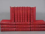 a stack of red books sitting on top of each other