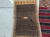 several different colored rugs are laid out on the floor