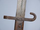 a close up of a sword with a metal handle