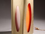 a lamp that is sitting on a table in a room