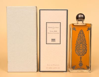 an image of a bottle of perfume sitting next to a box
