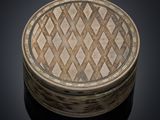 an image of a round wooden box with a pattern on it