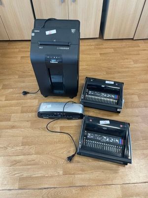 three different types of electronic equipment sitting on the floor