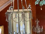 a chandelier hanging from the ceiling in a house