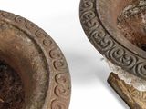 pair of antique cast iron candlesticks with decorative designs