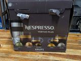 a box of nespresso vertuo plus coffee on a wooden table