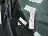 a parking ticket on the windshield of a car