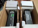 two remote controls in a box on a table