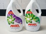 two bottles of ariel liquid sitting next to each other on a counter